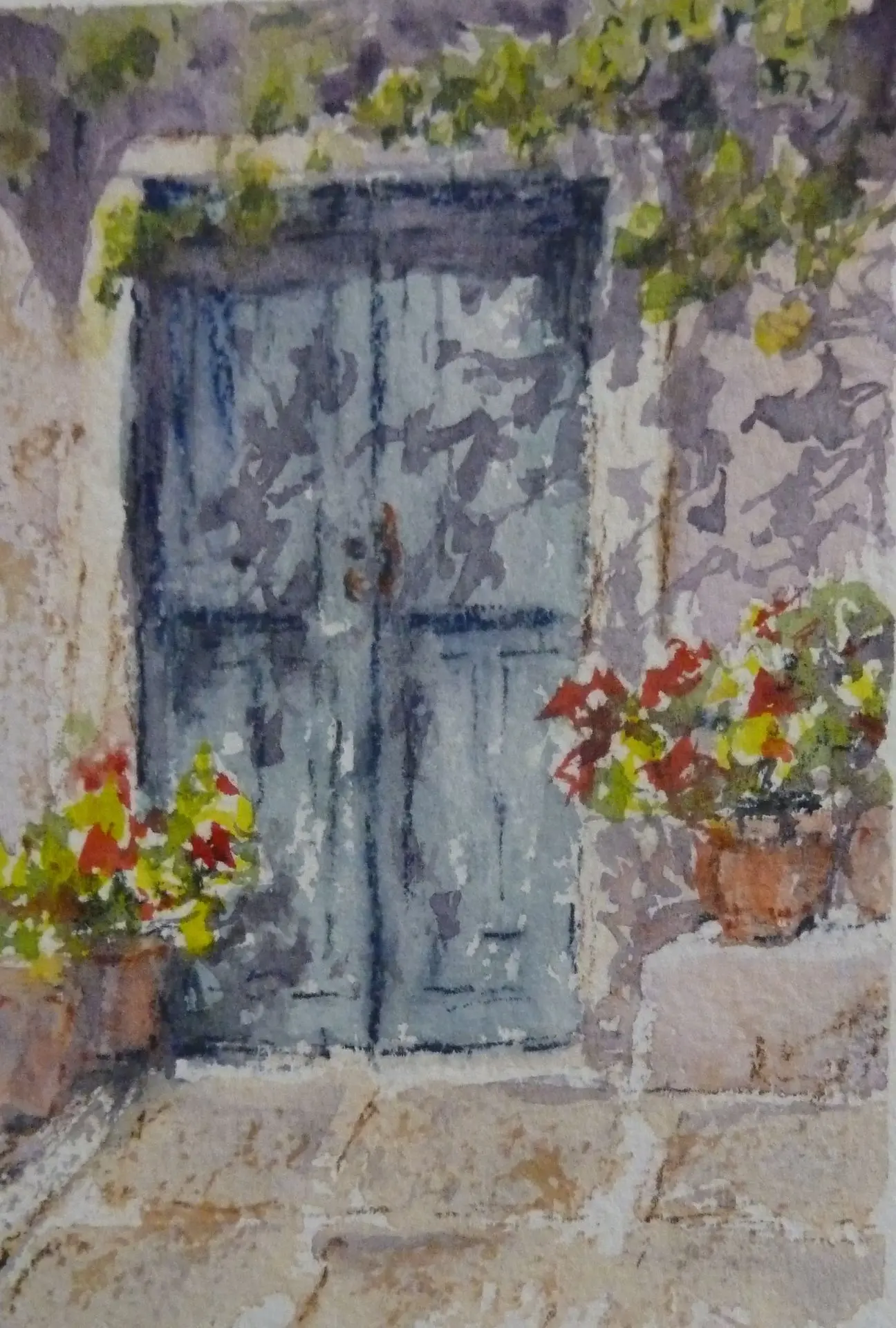 Door in wall with tree and flowers Door in wall with tree and flowers